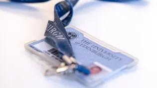 Image of a University of Edinburgh card and lanyard on a white table